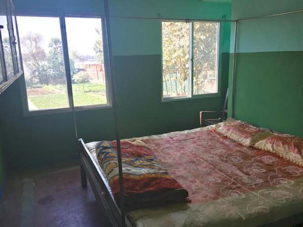 Imagen de la habitación del Hotel Goroomgo Ansari House Bodhgaya. Foto 4