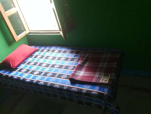 Imagen de la habitación del Hotel Goroomgo Ansari House Bodhgaya. Foto 7
