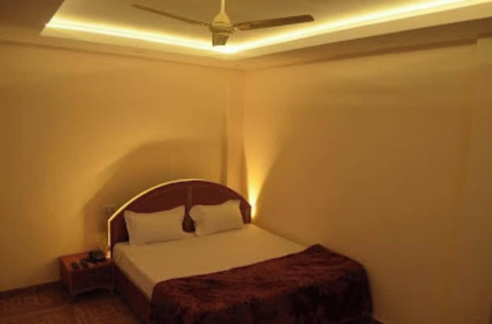 Imagen de la habitación del Hotel Goroomgo Assi River Guest House Varanasi. Foto 6