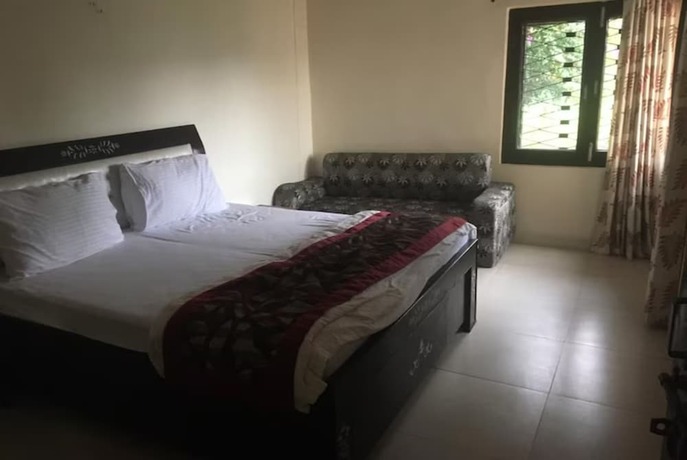 Imagen de la habitación del Hotel Goroomgo Blue Moon Bhimtal. Foto 14