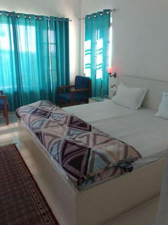Imagen de la habitación del Hotel Goroomgo Colonel Cottage Lake View. Foto 21