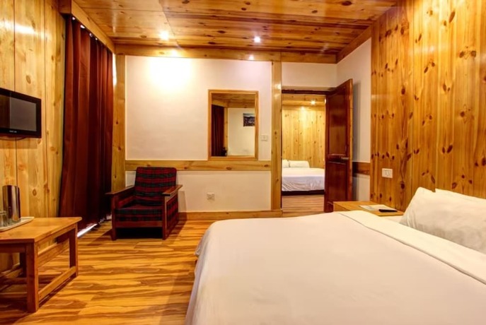 Imagen de la habitación del Hotel Goroomgo Conifer Manali. Foto 15