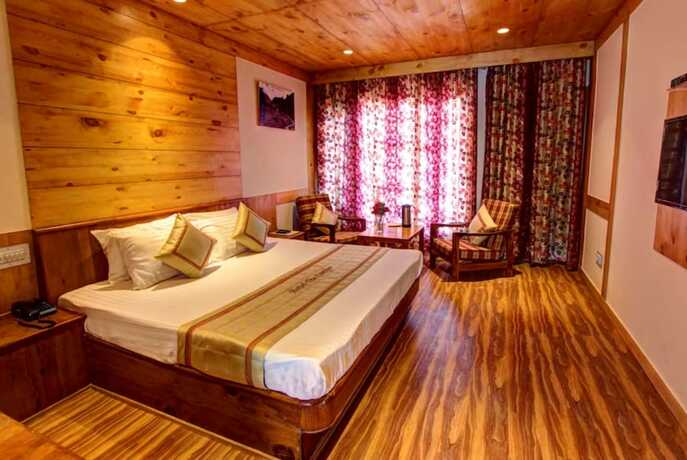 Imagen de la habitación del Hotel Goroomgo Conifer Manali. Foto 17