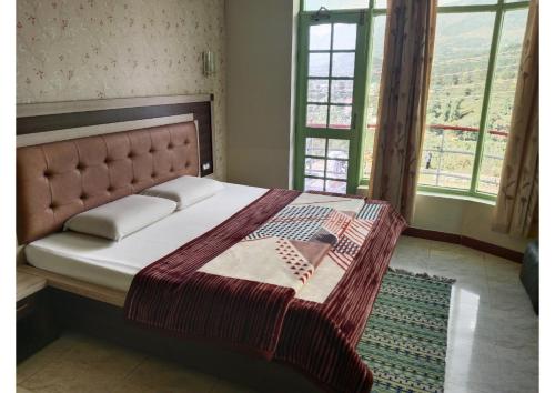 Imagen de la habitación del Hotel Goroomgo Dolphin Dalhousie-Near shakti peeth chamunda Devi temple. Foto 19