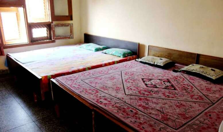 Imagen de la habitación del Hotel Goroomgo Gayatri Guest House Haridwar. Foto 15