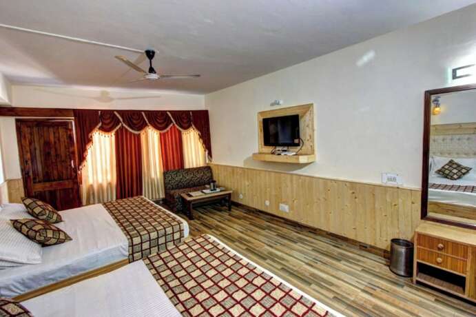Imagen de la habitación del Hotel Goroomgo Highway Inn Manali. Foto 15