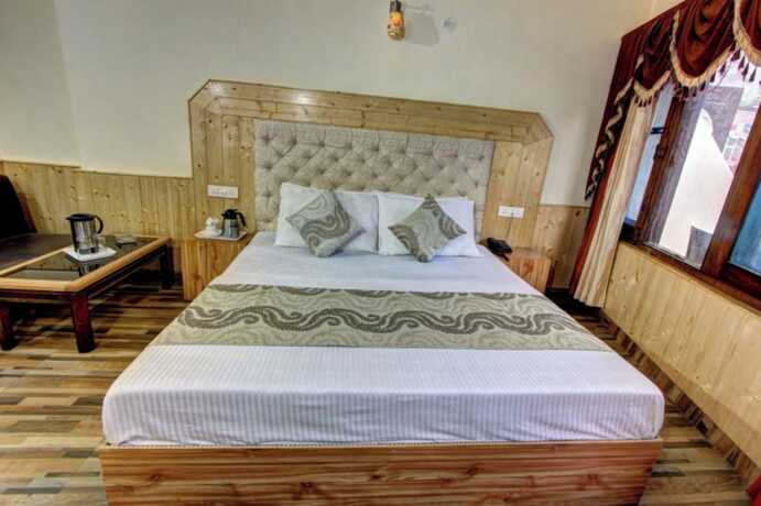 Imagen de la habitación del Hotel Goroomgo Highway Inn Manali. Foto 18