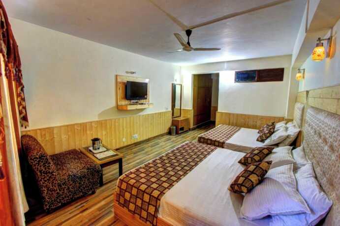 Imagen de la habitación del Hotel Goroomgo Highway Inn Manali. Foto 19