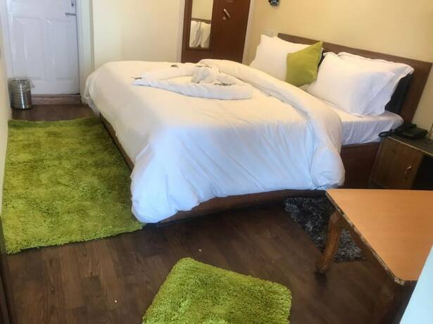 Imagen de la habitación del Hotel Goroomgo Jakhoo Vibes Shimla. Foto 7