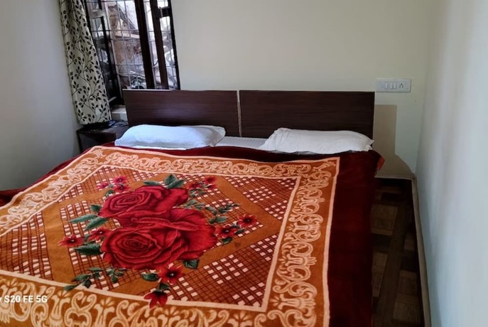 Imagen de la habitación del Hotel Goroomgo Kaafal Homestay Mussoorie. Foto 10