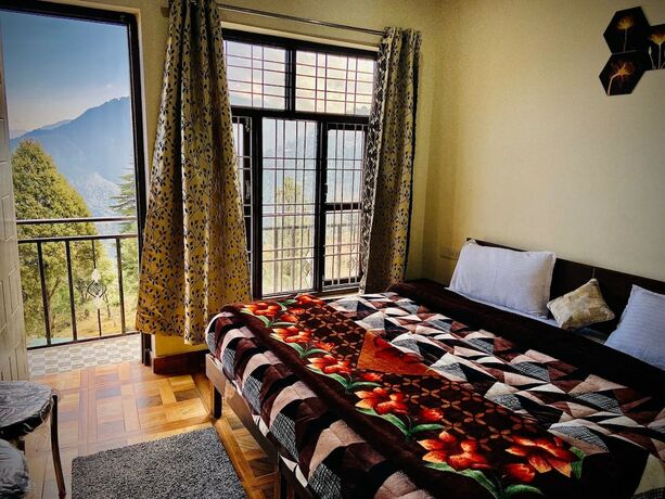 Imagen de la habitación del Hotel Goroomgo Kaafal Homestay Mussoorie. Foto 11