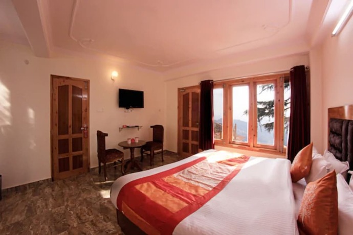 Imagen de la habitación del Hotel Goroomgo Kalara Regency Shimla. Foto 15