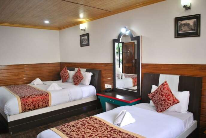 Imagen de la habitación del Hotel Goroomgo Kasturi Palace Darjeeling. Foto 10