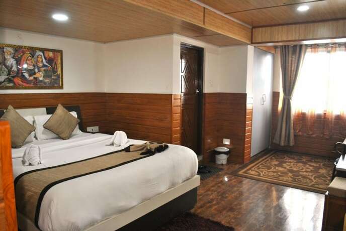 Imagen de la habitación del Hotel Goroomgo Kasturi Palace Darjeeling. Foto 12
