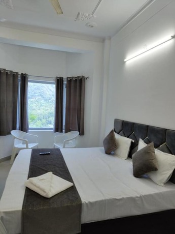 Imagen de la habitación del Hotel Goroomgo Komfy Stayz Dehradun. Foto 15