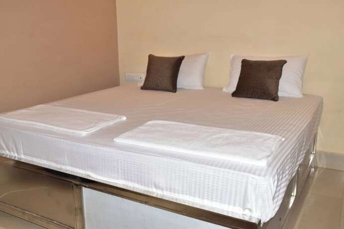 Imagen de la habitación del Hotel Goroomgo Maya Inn Guest House Varanasi. Foto 10