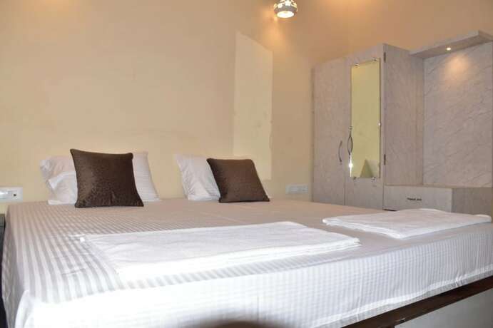 Imagen de la habitación del Hotel Goroomgo Maya Inn Guest House Varanasi. Foto 12