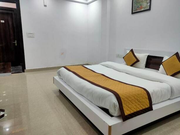 Imagen de la habitación del Hotel Goroomgo Mountain Mist Home Stay Bhimtal. Foto 11