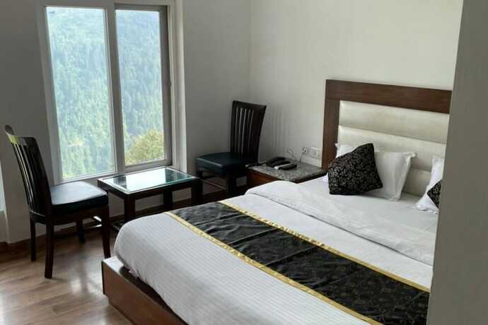 Imagen de la habitación del Hotel Goroomgo Namaskar Heights Dalhousie. Foto 11