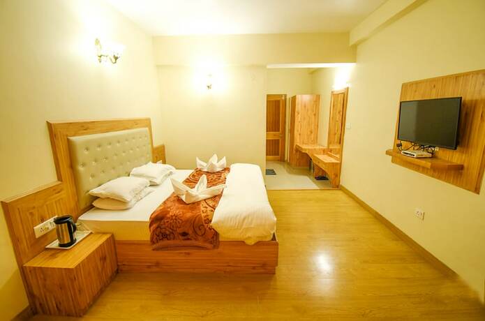 Imagen de la habitación del Hotel Goroomgo New Ambika Mall Road Manali. Foto 18