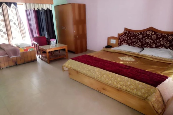 Imagen de la habitación del Hotel Goroomgo New Ambika Mall Road Manali. Foto 19