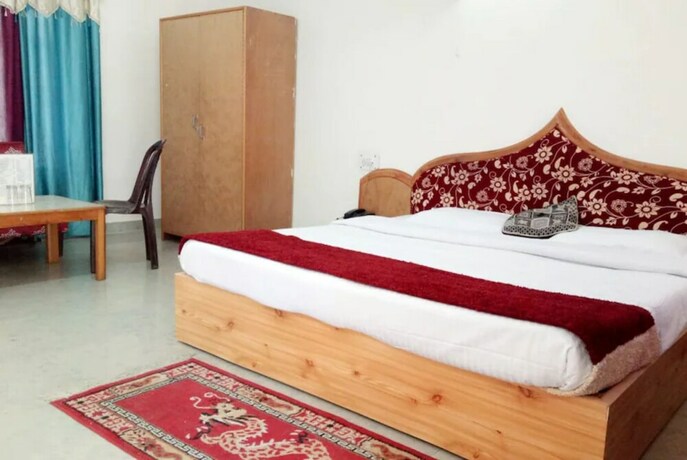 Imagen de la habitación del Hotel Goroomgo New Ambika Mall Road Manali. Foto 20