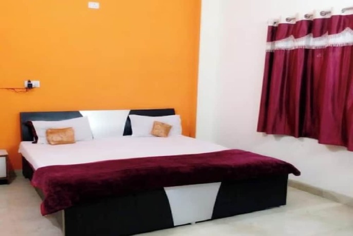 Imagen de la habitación del Hotel Goroomgo New Ashiyana Palace Varanasi. Foto 14