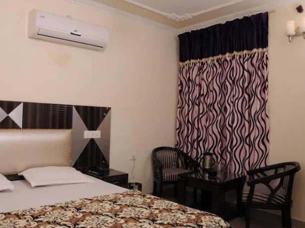 Imagen de la habitación del Hotel Goroomgo New Grand Residency Chandigarh. Foto 19