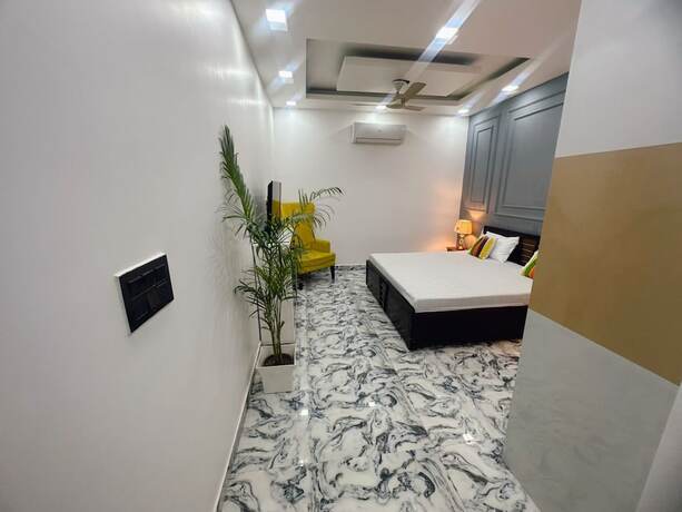 Imagen de la habitación del Hotel Goroomgo Omasha Residency Noida. Foto 18