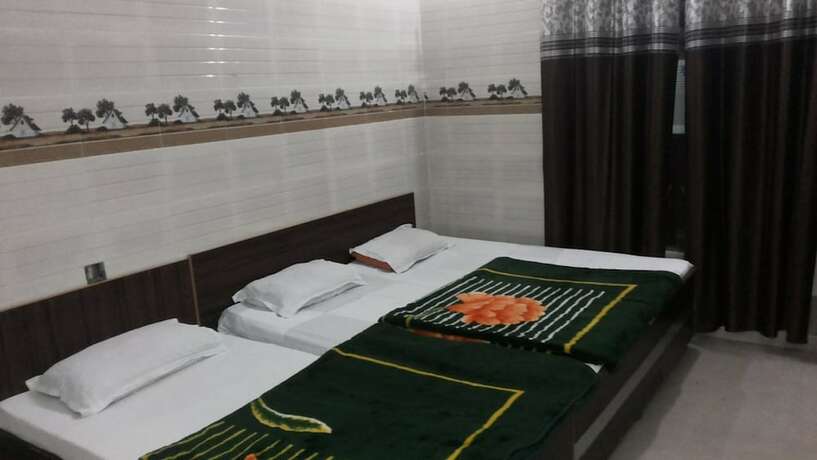 Imagen de la habitación del Hotel Goroomgo Sai Kripa Guest House Haridwar. Foto 10