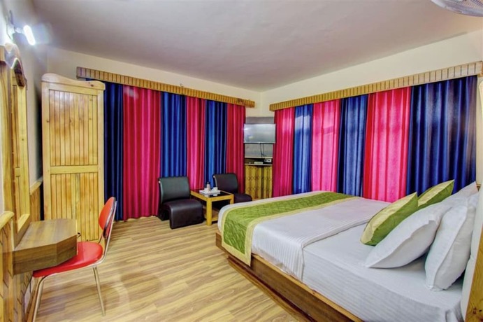 Imagen de la habitación del Hotel Goroomgo Samiru Manali. Foto 16