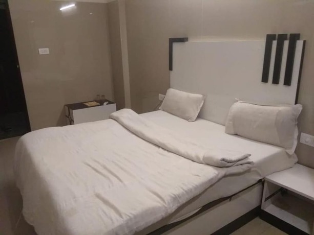 Imagen de la habitación del Hotel Goroomgo Shiva Inn Haridwar. Foto 5