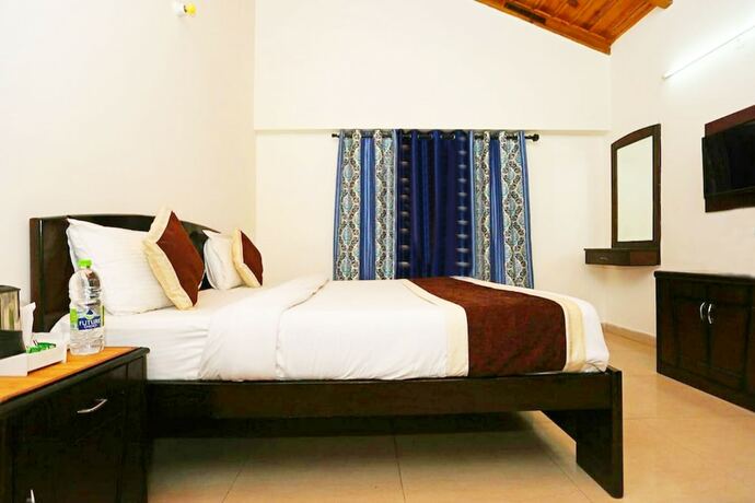 Imagen de la habitación del Hotel Goroomgo Silvertree Inn Bhimtal. Foto 9