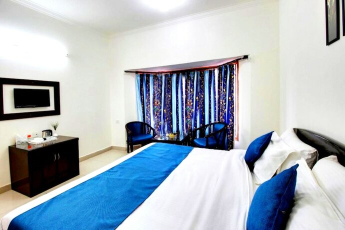Imagen de la habitación del Hotel Goroomgo Silvertree Inn Bhimtal. Foto 10