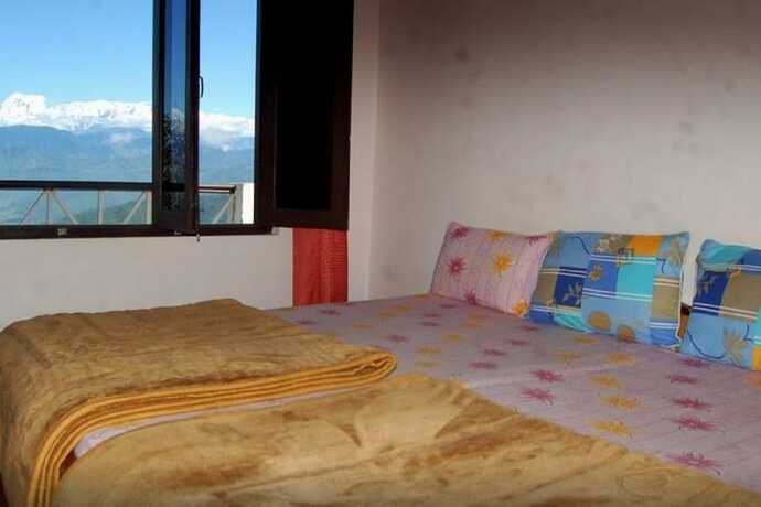 Imagen de la habitación del Hotel Goroomgo Snow View Guest House Kausani. Foto 5