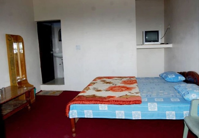 Imagen de la habitación del Hotel Goroomgo Snow View Guest House Kausani. Foto 7