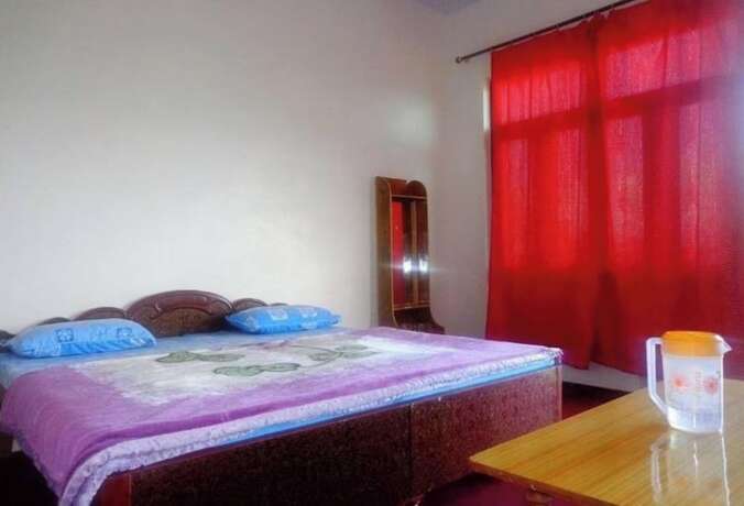Imagen de la habitación del Hotel Goroomgo Snow View Guest House Kausani. Foto 10