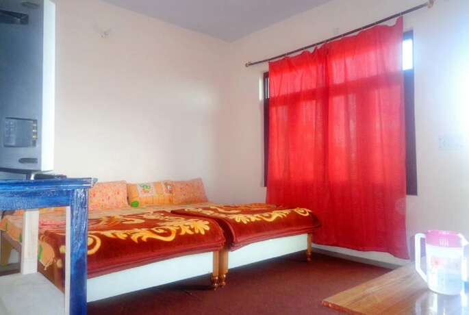 Imagen de la habitación del Hotel Goroomgo Snow View Guest House Kausani. Foto 11
