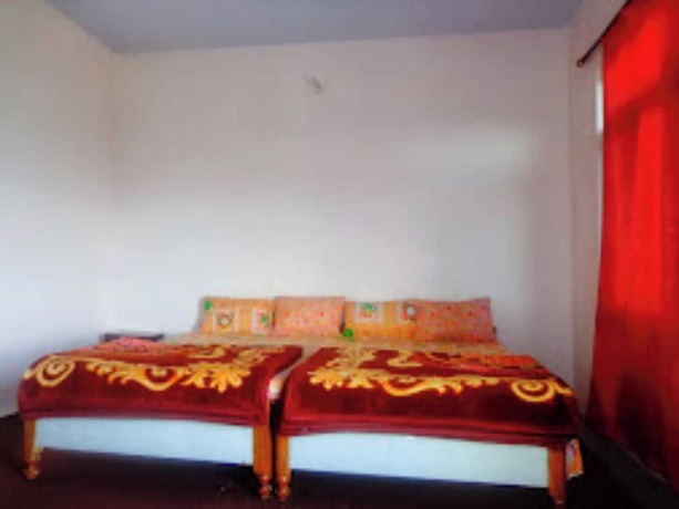 Imagen de la habitación del Hotel Goroomgo Snow View Guest House Kausani. Foto 12
