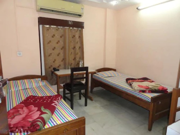 Imagen de la habitación del Hotel Goroomgo Suhana Homestay Guwahati. Foto 8
