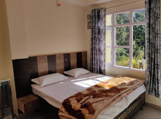 Imagen de la habitación del Hotel Goroomgo Sukh Dham Homestay Shimla. Foto 13