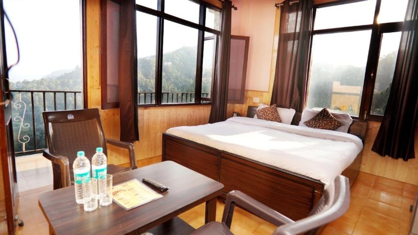 Imagen de la habitación del Hotel Goroomgo Thakur Home\'s Shimla. Foto 10
