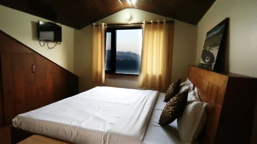 Imagen de la habitación del Hotel Goroomgo Thakur Home\'s Shimla. Foto 14