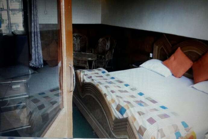 Imagen de la habitación del Hotel Goroomgo Tribhuwan Ranikhet. Foto 15