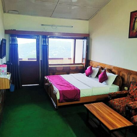 Imagen de la habitación del Hotel Goroomgo Tribhuwan Ranikhet. Foto 18