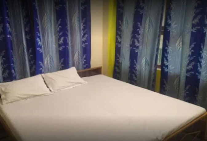 Imagen de la habitación del Hotel Goroomgo Uma Ganga Guest House Varanasi. Foto 16