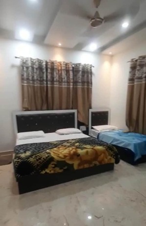 Imagen de la habitación del Hotel Goroomgo Yuvraj Residency Amritsar. Foto 19