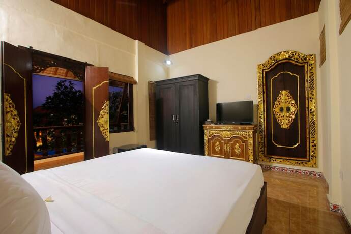 Imagen de la habitación del Hotel Graha Madesimon. Foto 21