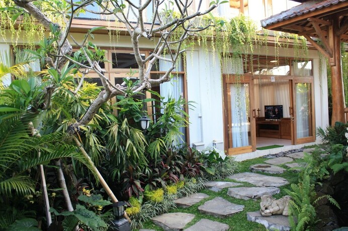 Imagen de la habitación del Hotel Graha Sandat Villas By Pramana Villas - Chse Certified. Foto 26