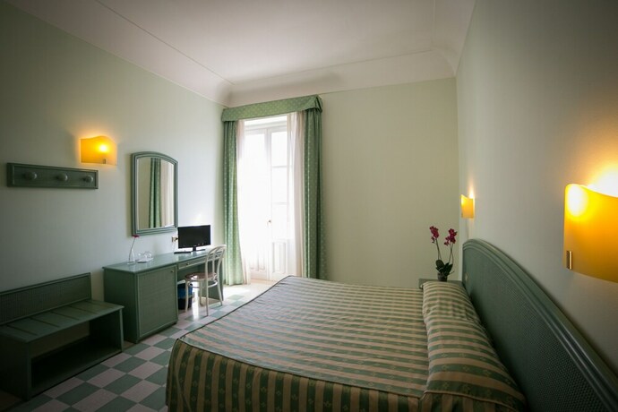 Imagen de la habitación del Hotel Gran Bretagna Boutique Hotel Ortigia. Foto 24